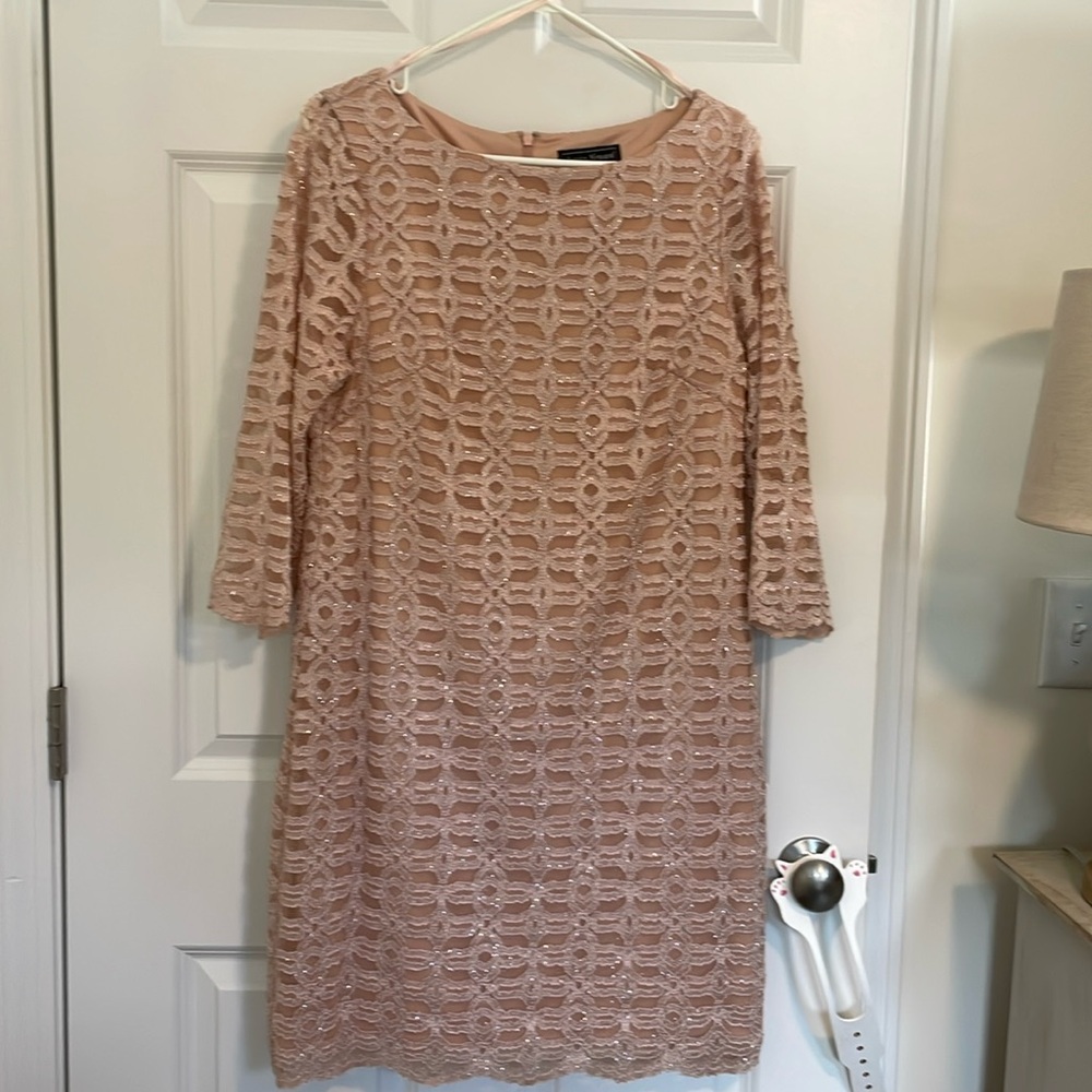 Pretty peach colored dress.